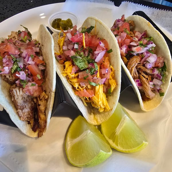 Venezuelan-style tacos with meat, pico de gallo and lime.