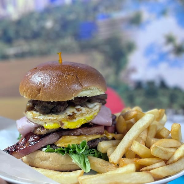 BurgerMania four-meat burger with fries.