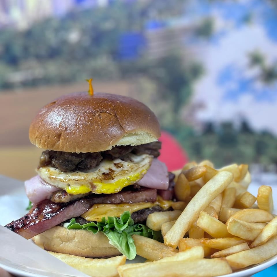 BurgerMania four-meat burger with fries.